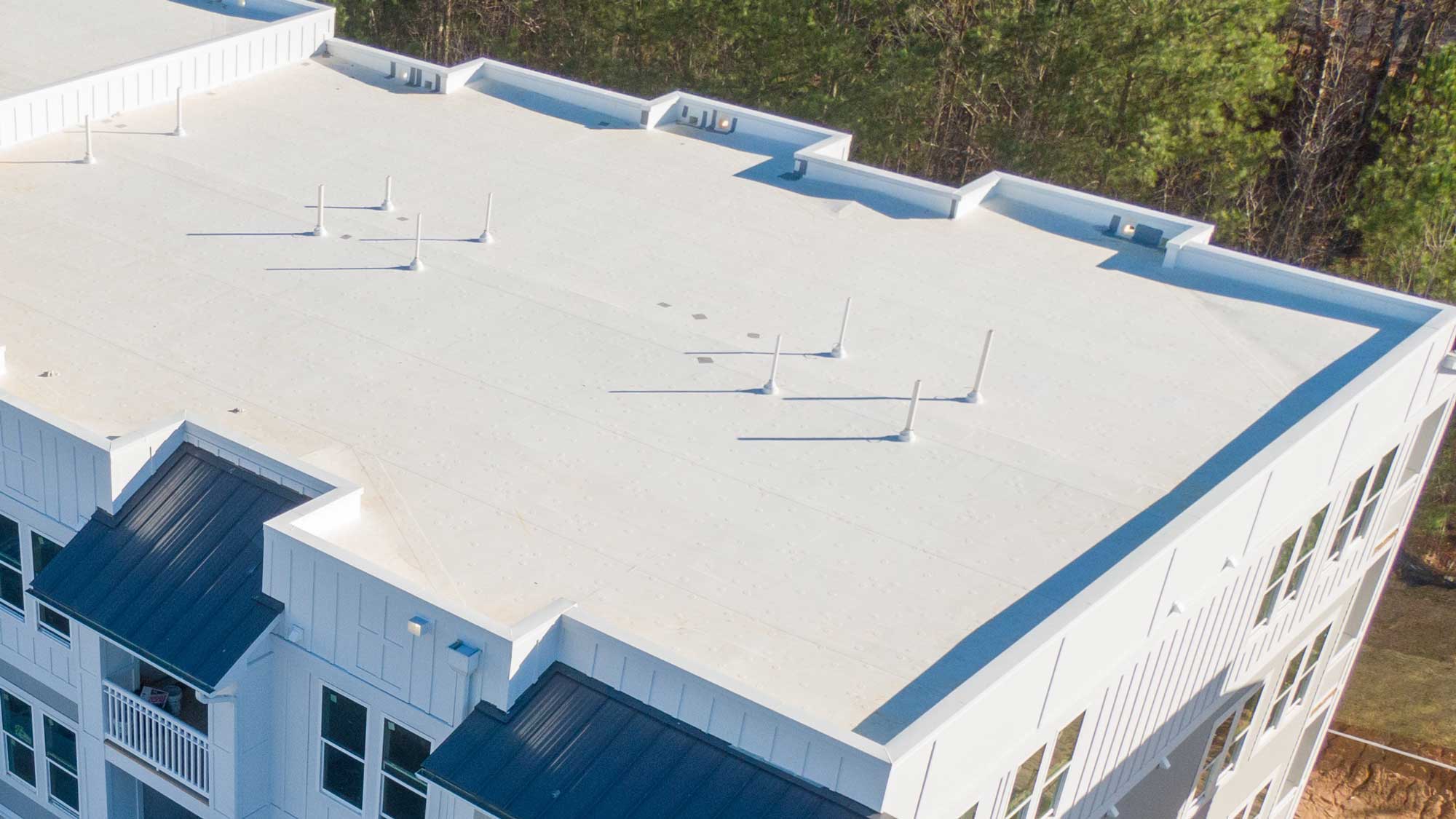 A brand-new flat roofing system on a commercial building