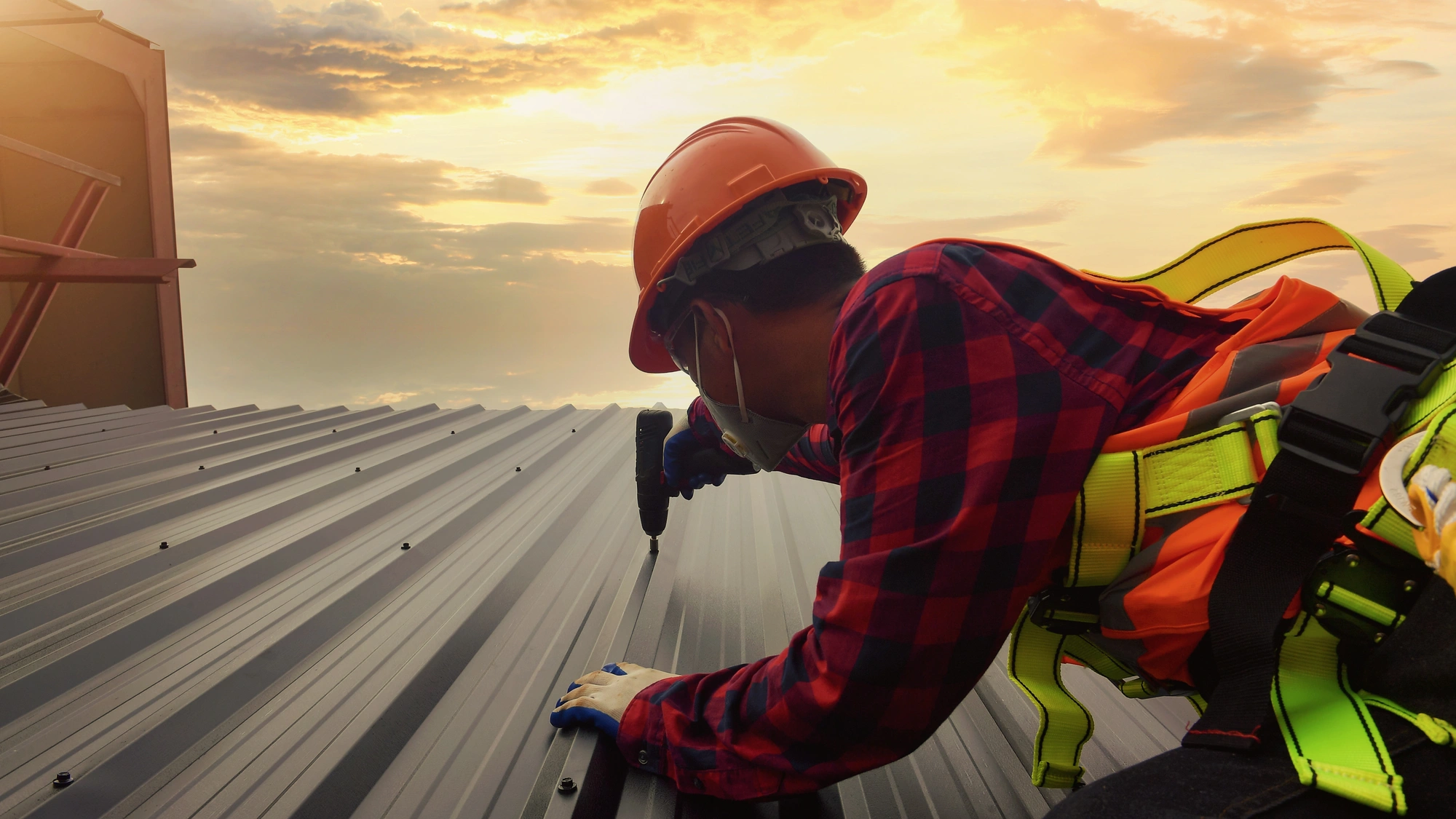 A roofer repairs a commercial roof