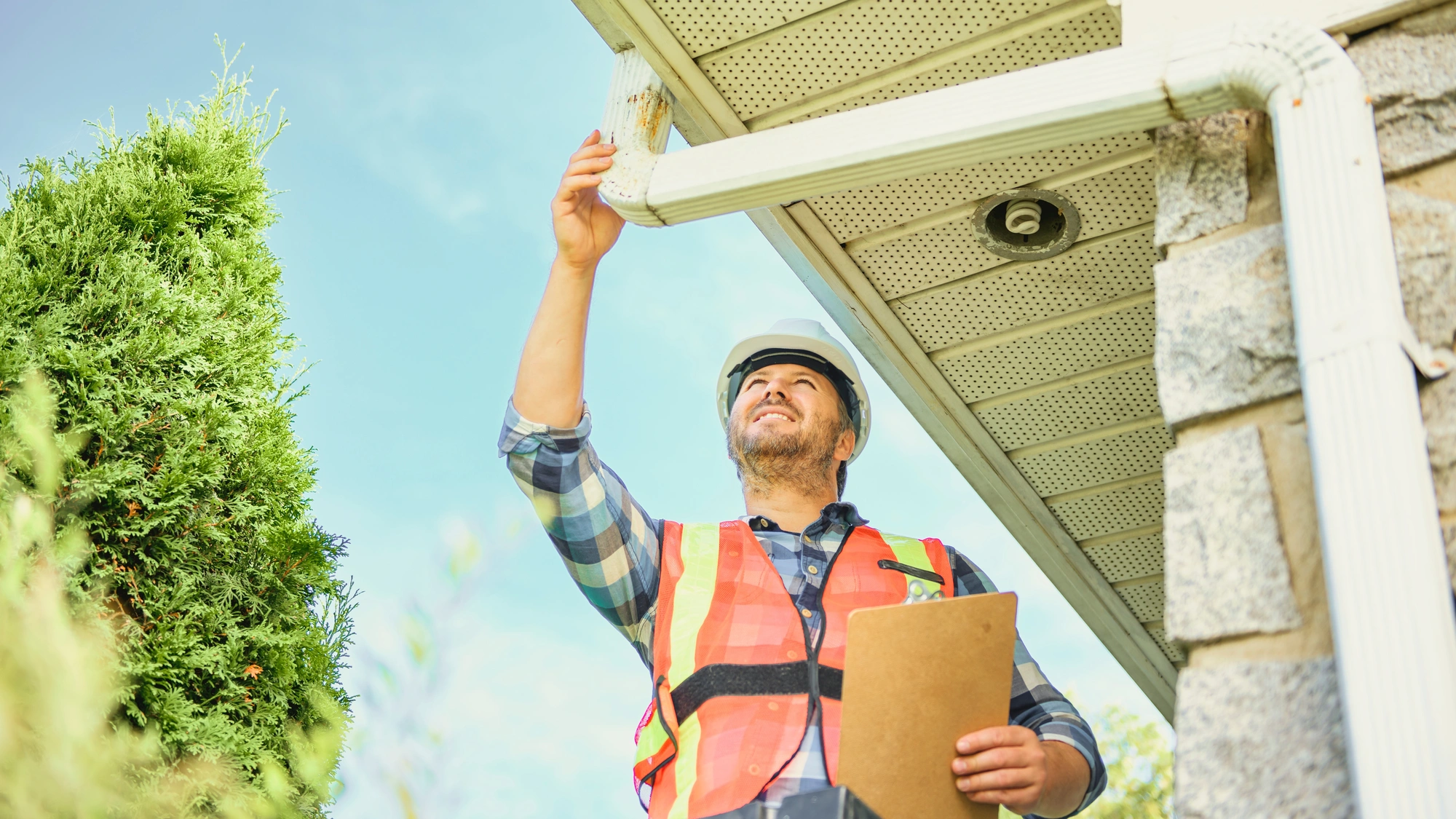 A roofing contractor completes an inspection