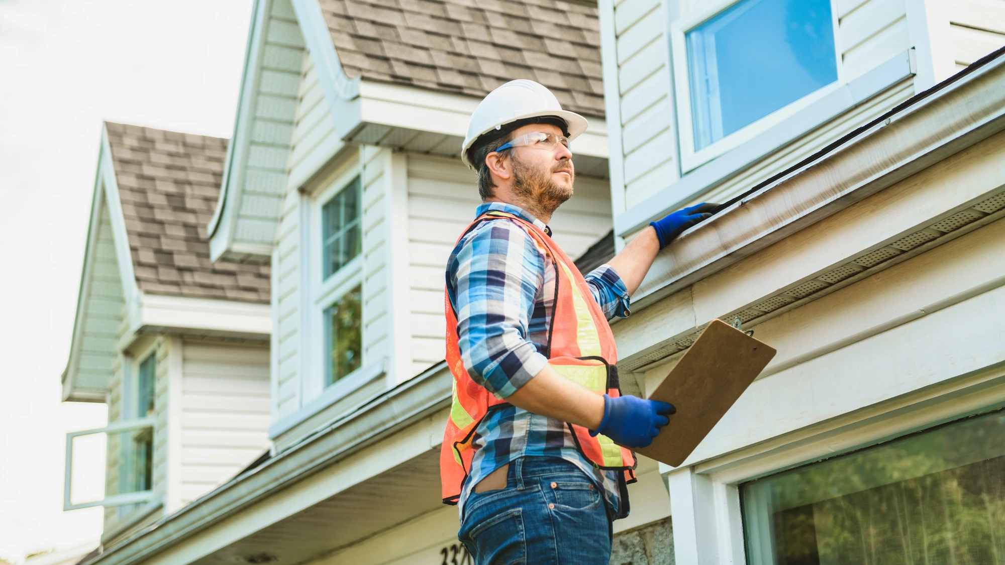 A roofing contractor completes an inspection