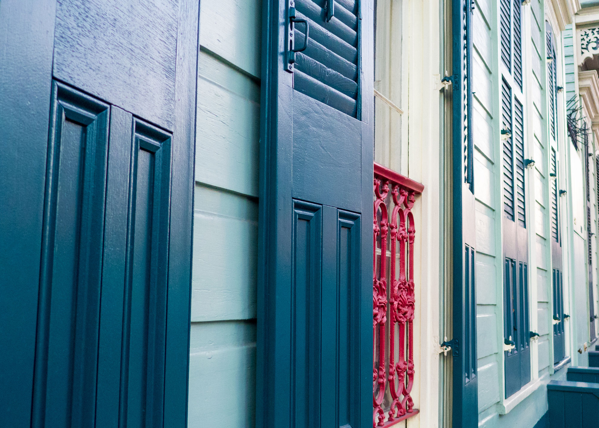 Close up on freshly painted blue shutters and siding