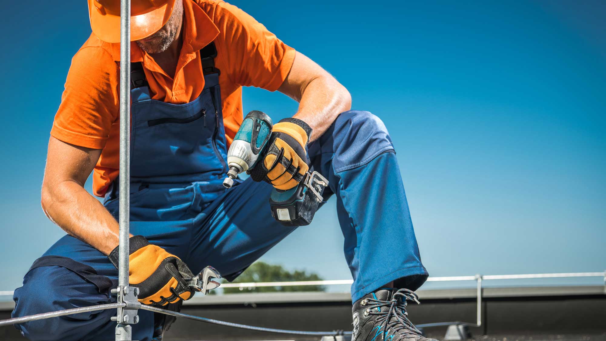 A roofer repairing a commercial roof