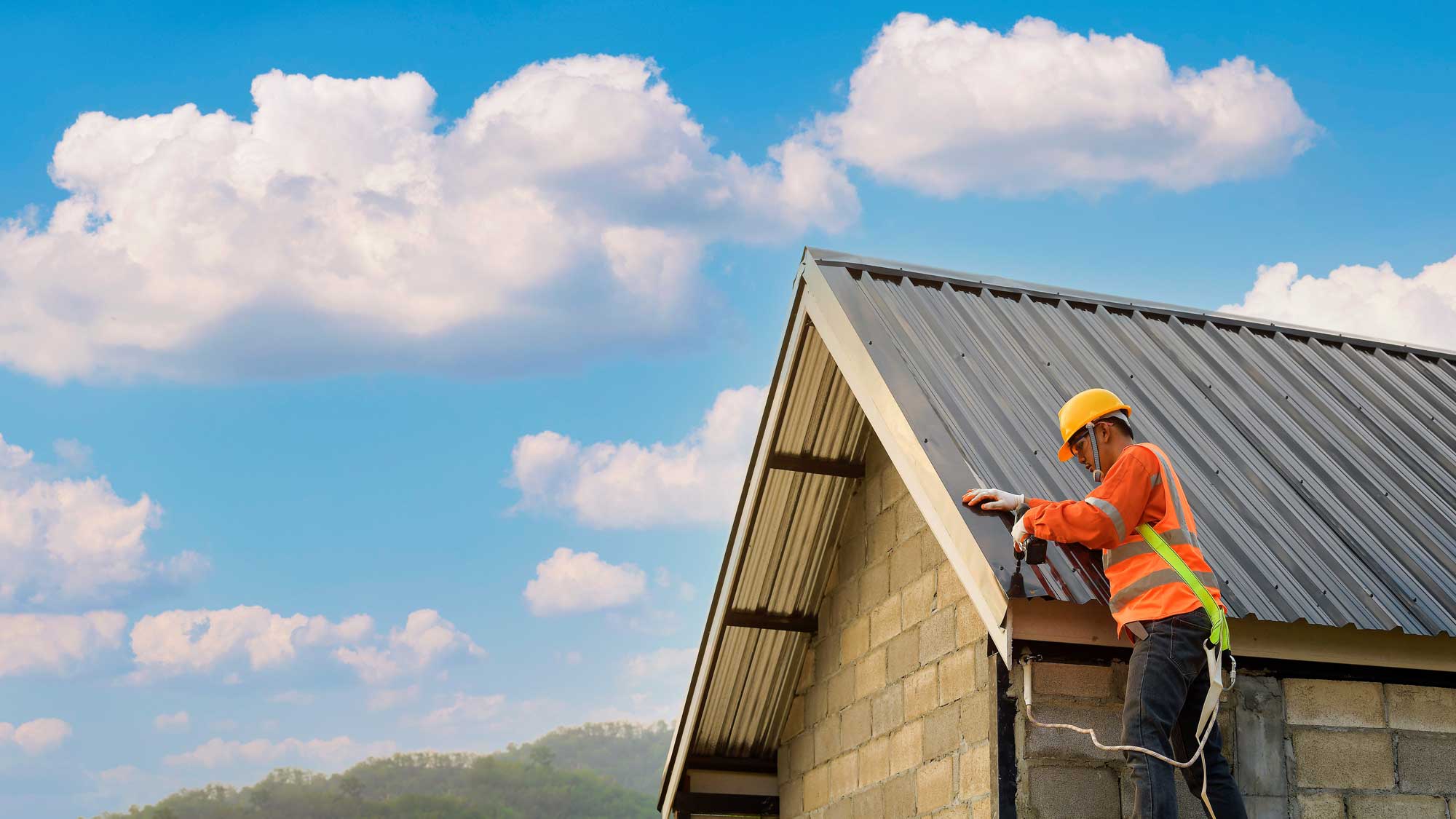 A roofer repairing a commercial roof