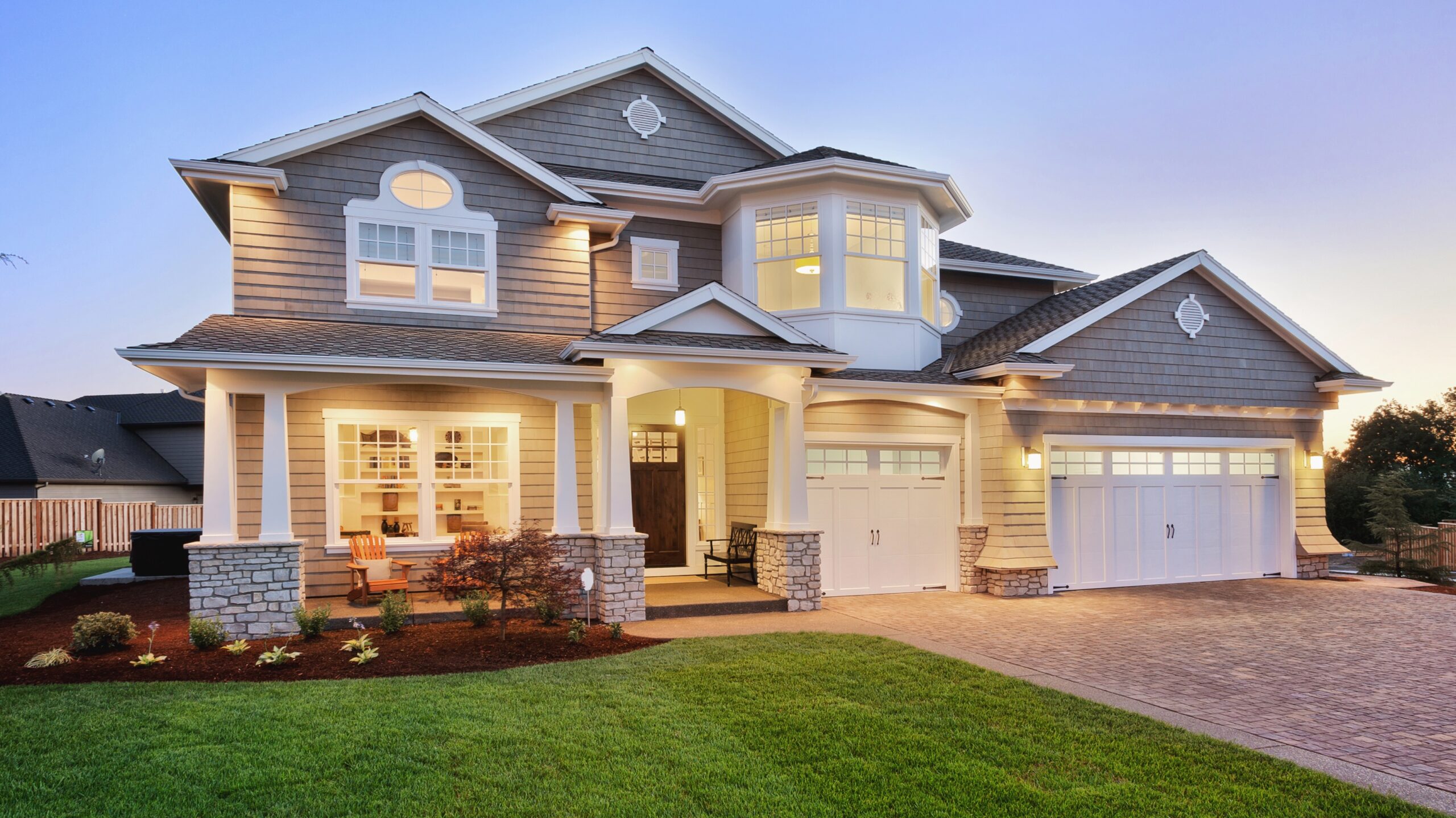 Large gray home with white trim and windows